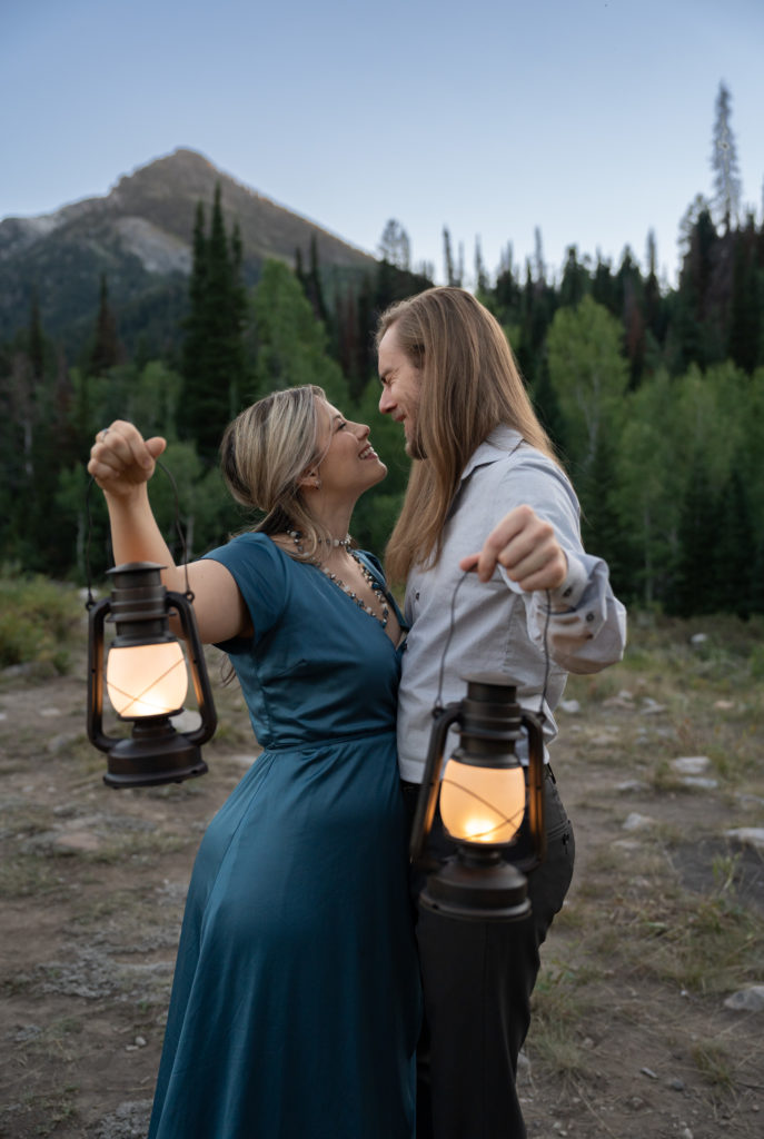 Couple with lanterns at blue hour in Big Cottonwood Canyon in Salt Lake City, Utah