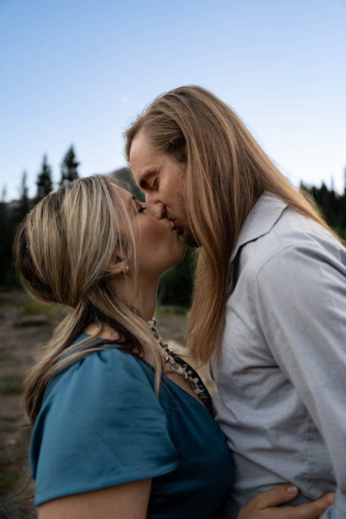 Couple kissing at blue hour in Big Cottonwood Canyon in Salt Lake City, Utah