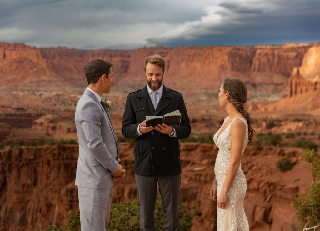 Officiant with bride and groom in Capitol Reef National Park