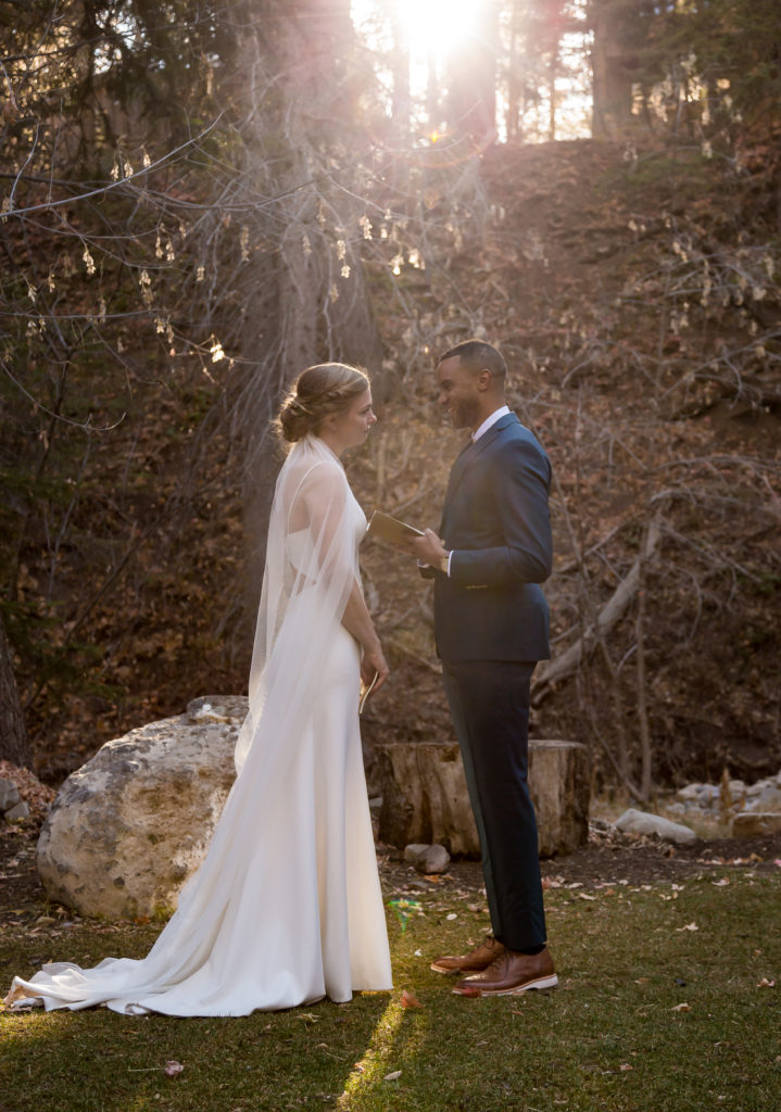 Mountain Elopement Locations Near Salt Lake  - Interracial bride and groom saying vows to each other