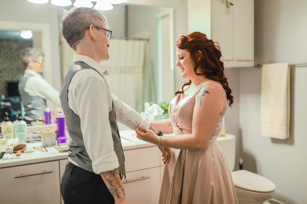 LGBTQIA+ mountain elopement in Salt Lake City, Utah. Two brides getting ready together at their apartment before their elopement.