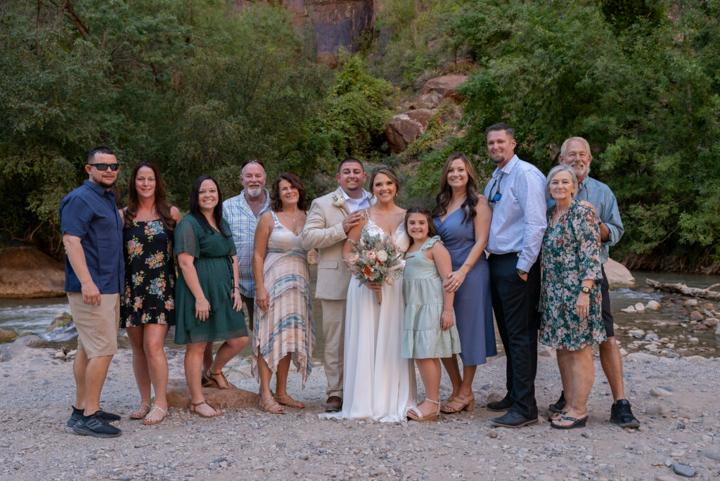 Bride and groom with guests at the Temple of Sinawava in Zion National Park in Utah