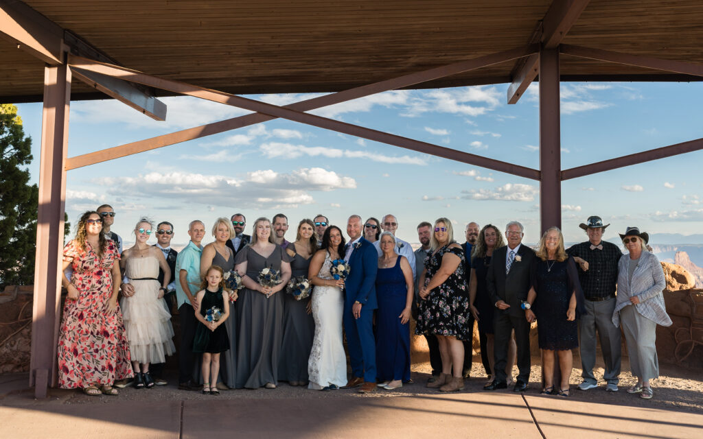 Bride and groom with their loved ones after their ceremony at Dead Horse Point State Park in Moab, Utah