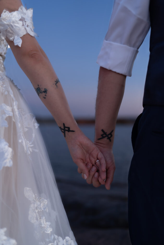 Closeup of couple's matching tattoos